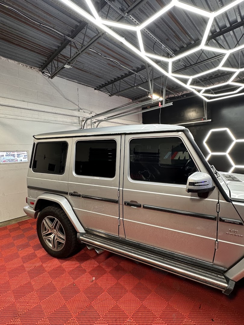 Vinyl wrapping on Mercedes G-Wagon inside Auto Addict shop